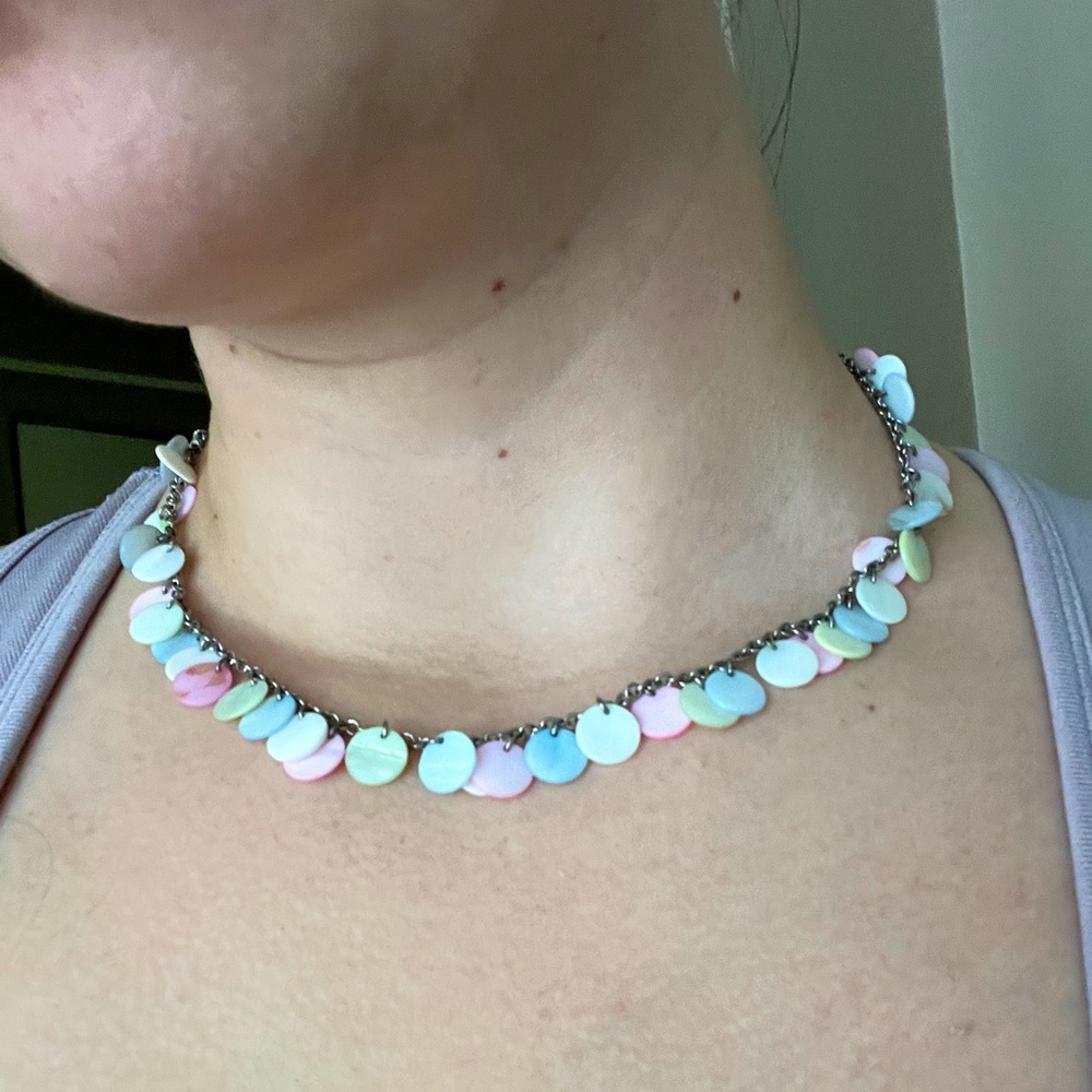 Pastel circle bead necklace on a chain.